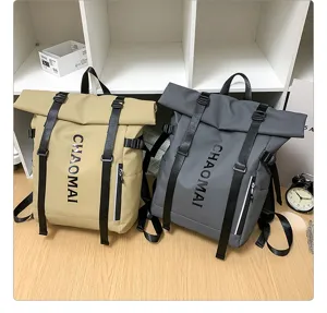 Detail view of stylish roll-top waterproof backpacks featuring vertical straps and front pockets.