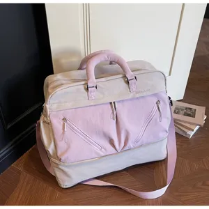 Large capacity travel duffel bag for women, multi-pocket weekend overnight bag with shoulder strap.