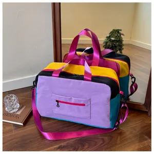 Color-blocking travel duffel bag with vibrant hues, large capacity gym tote and crossbody bag.