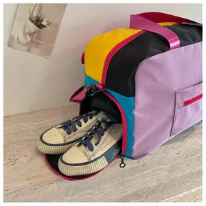 Colorblock travel duffel bag with shoe compartment for weekend trips, yoga and fitness gym use.