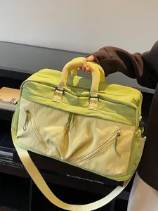 Large capacity travel duffel bag for women, lightweight waterproof sports gym luggage bag.