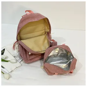 Set zaino in corduroy rosa con borsa scolastica e borsa pranzo per l'uso quotidiano degli studenti.