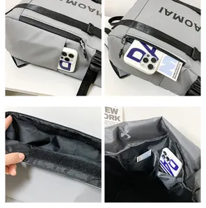 Detailed view of grey waterproof roll-top backpack, showing functional pockets and large capacity.