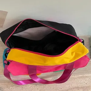Color-block duffel travel bag for women, stylish gym shoulder bag and luggage organizer.