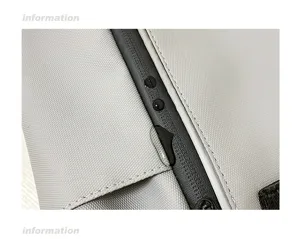 Detail shot of grey waterproof backpack fabric and zipper, showing excellent water resistance.