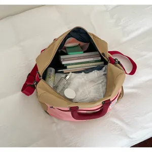Color-blocked travel duffel bag, large capacity portable fitness and gym luggage bag.