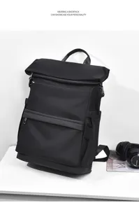 Detailed view of a black roll-top backpack, large capacity laptop bag for commuter travel.