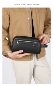 Sac à main élégant pour homme en cuir noir d'affaires avec fermeture éclair et poignée.