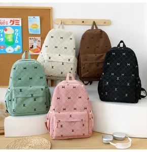 Sac à dos décontracté en velours côtelé avec nœud, cartable coloré et grande capacité.