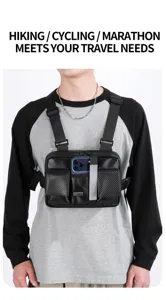Black techwear tactical chest bag detail, multi-pocket streetwear rig with phone holder.