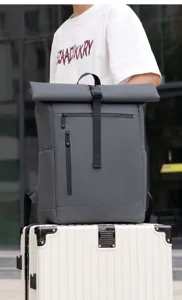 Grey waterproof roll top backpack for men, ideal for business commuting and outdoor travel.