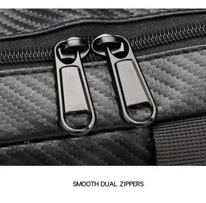 Detail view of the tactical chest bag featuring smooth dual zippers and durable carbon texture.