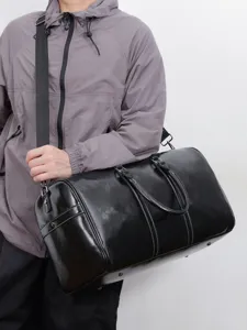 Sac de voyage en cuir PU noir pour hommes et femmes, sac de sport et bandoulière élégant.