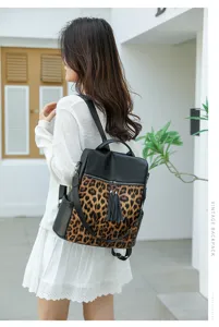 Vintage Damen Rucksack mit Leo Muster modische Umhängetasche mit Quasten Reißverschluss.
