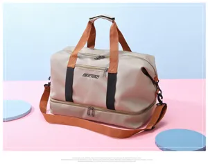 Vue détaillée du sac de voyage grande capacité avec compartiment inférieur et poignées solides.