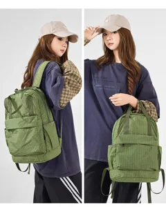 Green plaid oxford backpack detail showing comfortable shoulder straps and lightweight design.