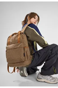 Plaid nylon fabric backpack for women, lightweight foldable large capacity casual daypack.