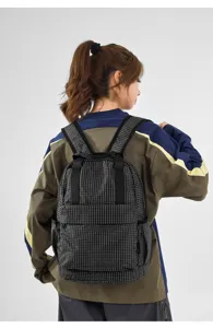 Lightweight foldable plaid backpack detail view, featuring durable oxford fabric and comfortable straps.