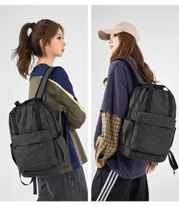 Detail view of the lightweight oxford cloth plaid backpack, showcasing large capacity and folding design.