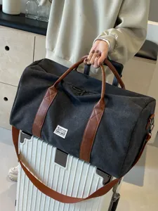 Grote canvas reistas met bruine lederen handgrepen, casual sport fitness weekender tas.
