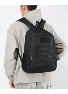 Detailed view of the black tactical backpack worn by a model, showing MOLLE webbing system.