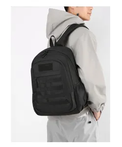 Black tactical backpack detail showing large capacity, molle webbing, and durable shoulder straps.