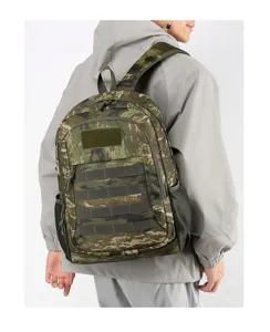 Detail shot of tactical camo backpack showing mesh side pocket and molle webbing design.