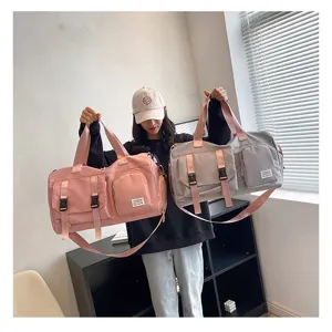 Large capacity multi-functional travel duffel bag with shoe compartment for sports and fitness.