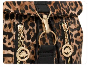 Leopard print backpack detail showing retro PU leather, gold hardware and front flap closure.