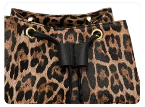 Leopard print PU leather backpack detail, gold eyelets, black drawstring closure style.