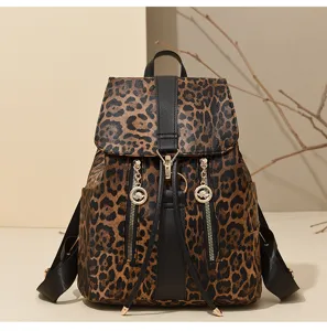 Close-up detail view of the retro leopard print PU leather backpack with zippers and flap.