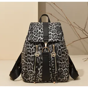 Stylish leopard print PU leather backpack for women, retro flap casual school book bag.