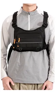 Detailed view of black tactical chest rig bag featuring zipper pockets and durable webbing.
