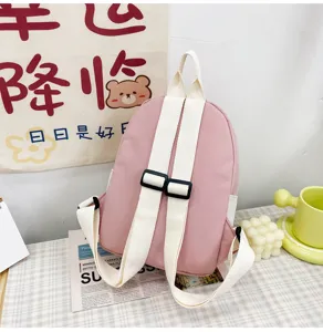 Mini zaino rosa per bambini con spalline bianche regolabili, simpatico zainetto casual.