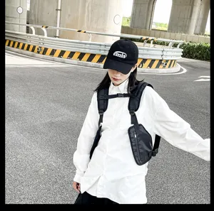 Tactical chest bag detail view, multi-functional outdoor streetwear vest with zipper pockets.