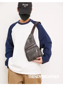 Detailed view of the stylish dark grey canvas sling chest bag with durable zipper pockets.