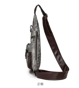 Detail view of casual canvas sling chest bag with brown PU leather strap and multi zippers.