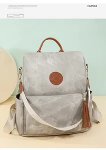 Lässiger Damen Anti-Diebstahl Rucksack aus Canvas mit braunen Lederdetails und Quaste