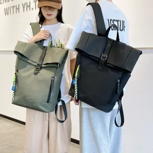 Close-up view of casual roll-top backpack details, shoulder straps and multi-pocket design.
