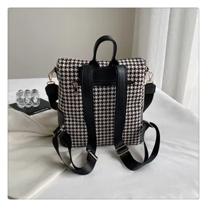 Klassieke houndstooth dames rugzak vintage zwart wit casual dagelijkse schooltas.