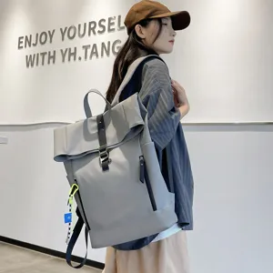 Stylish casual grey roll-top backpack with large capacity for school and daily travel.
