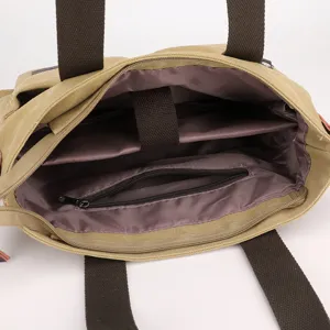 Lässige Canvas Tragetasche mit großer Kapazität, Innenfächern und Schultergurt.