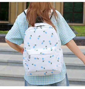 White floral backpack for school students with blue tulip print and large capacity design.