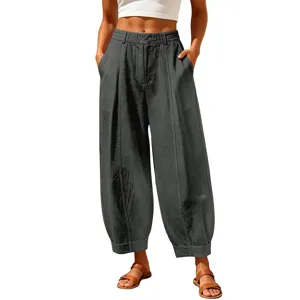 Detailed view of dark grey high-waisted cotton linen harem pants with side pockets