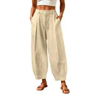 Women's loose fit beige cropped harem pants with high waist and vertical seam detail