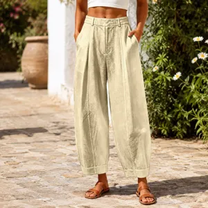 Close-up detail of beige linen-textured loose cropped harem pants for summer casual wear
