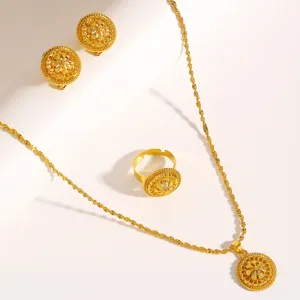 Detailed view of gold Middle Eastern filigree jewelry set with intricate circular patterns.
