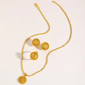 Detail of gold Arabic style jewelry set with intricate filigree flower pattern