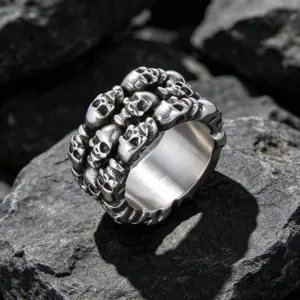 Vintage gothic men's titanium steel ring featuring multiple skulls on black rock background