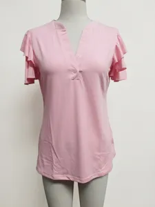Close-up of pink women's V-neck top showing elegant multi-layer ruffled sleeve detail.